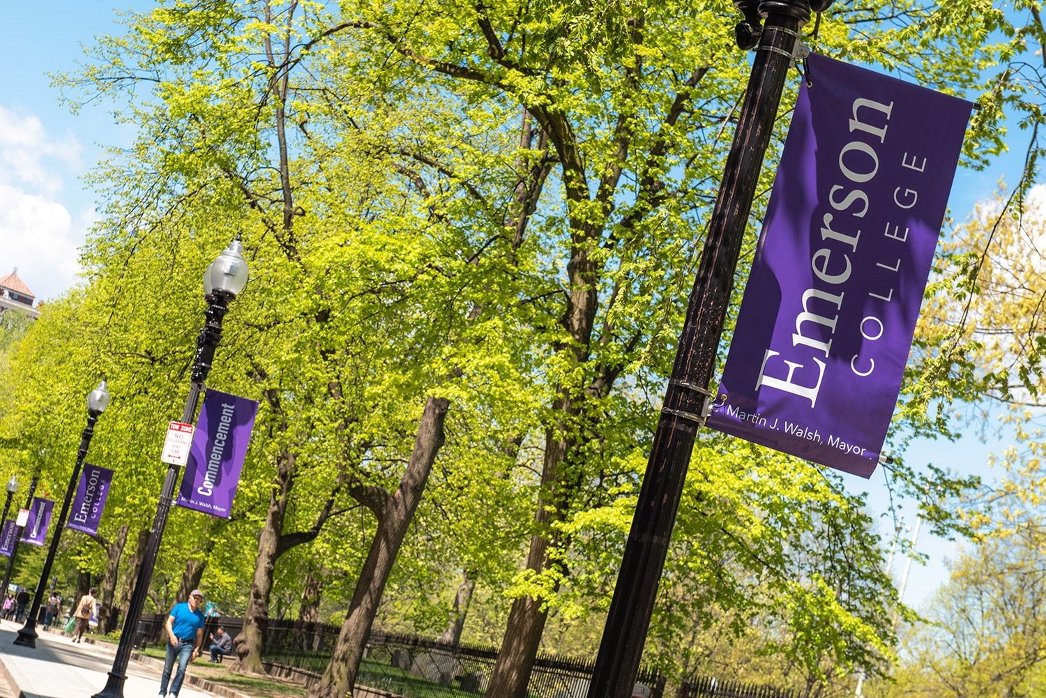 Purple Emerson banners hanging from poles on the street