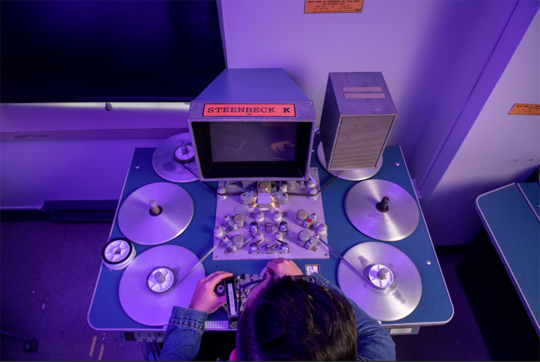 Student working on film tape in lab