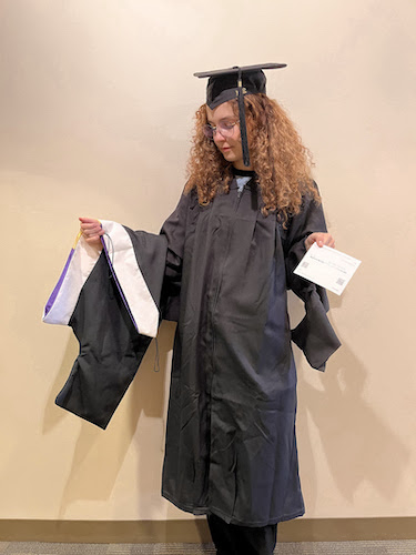 Mixed race woman wearing graduation cap and gown Stock Photo - Alamy