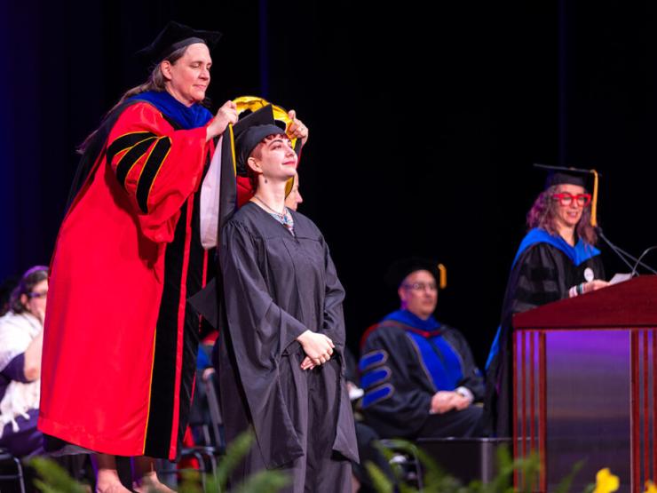 Master’s Graduates Celebrate Hard Work, ‘Possibility,’ at Hooding Ceremonies 