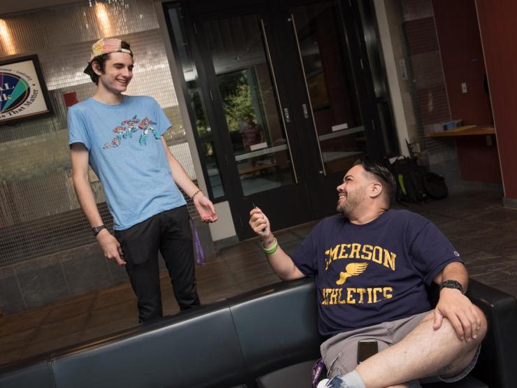 Students smiling in Piano Row lobby