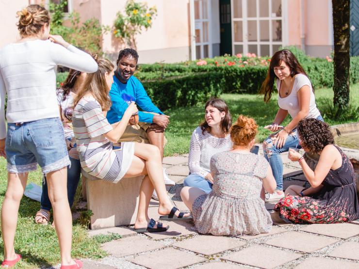 A group of students hanging out in a courtyard