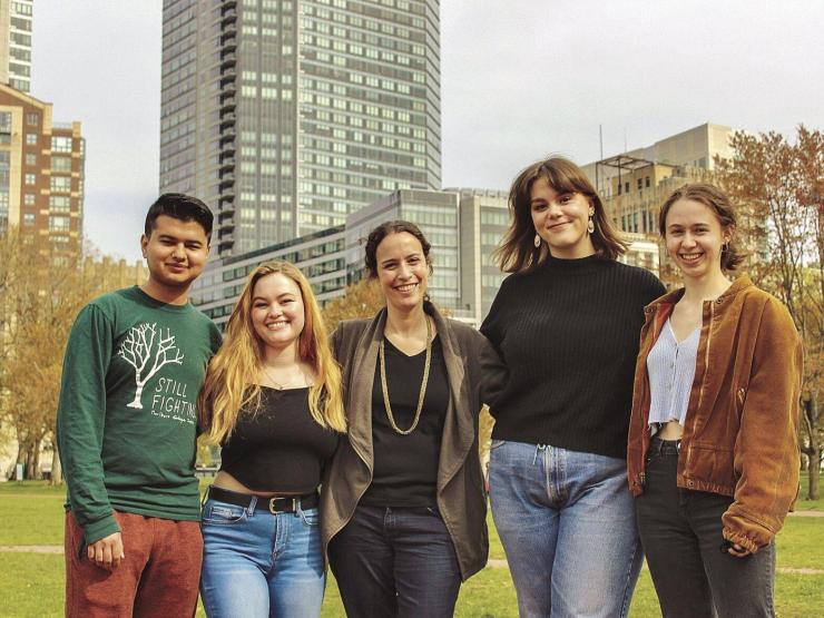 A photograph from the Brattleboro Reformer of four students and a professor taken by Tristan Homewood