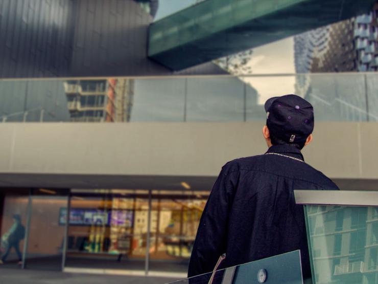 A student looking up at a building