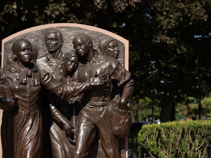 a photo of a statue of five people in Harriet Tubman Park