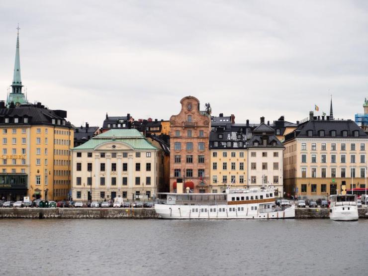 View of tall buildings in Stockholm across a waterway