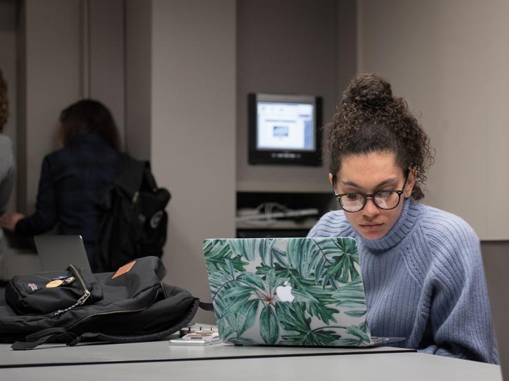 Student looking at her laptop computer