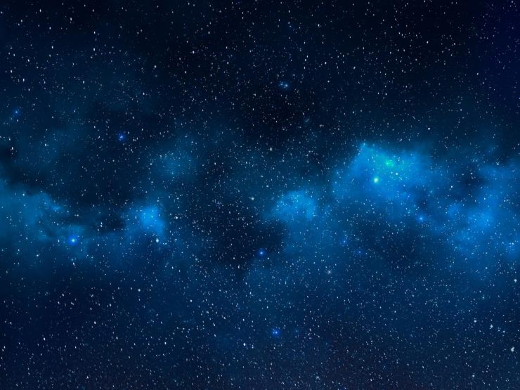 Blue-toned image of space with stars