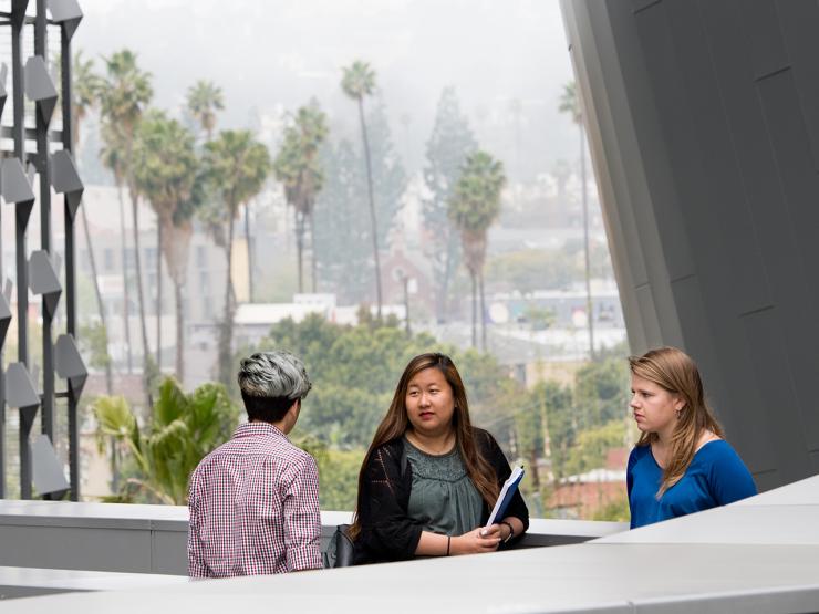 Emerson Los Angeles building outside with students standing against the cityscape