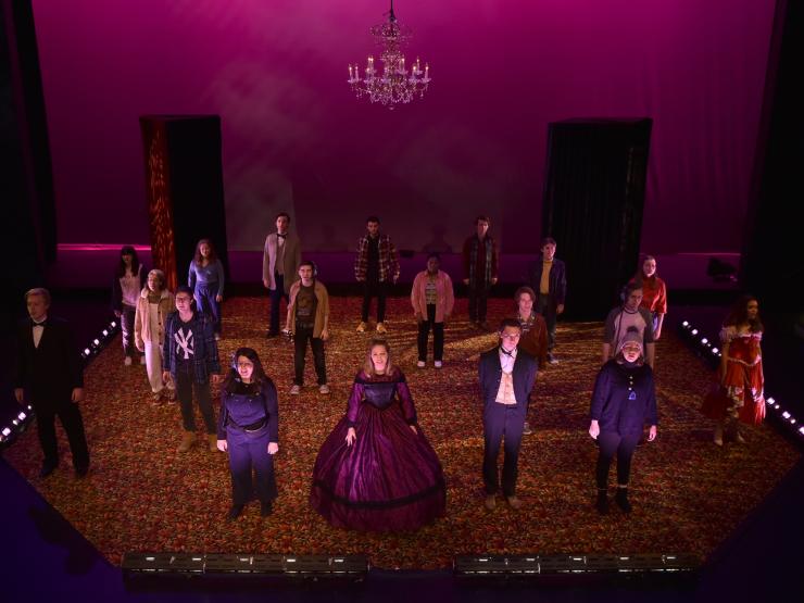 group of students performing on stage 