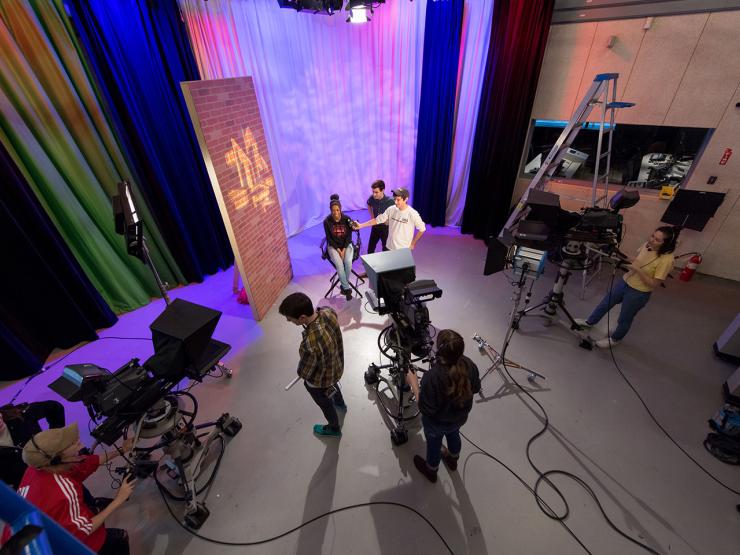 Students filming in a Tufte TV studio