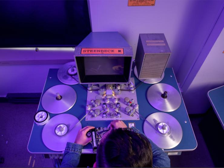 Student working on film tape in lab