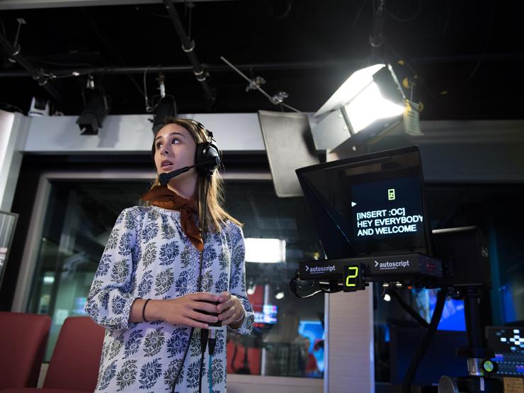 High school student in pre-college program on set in journalism studio