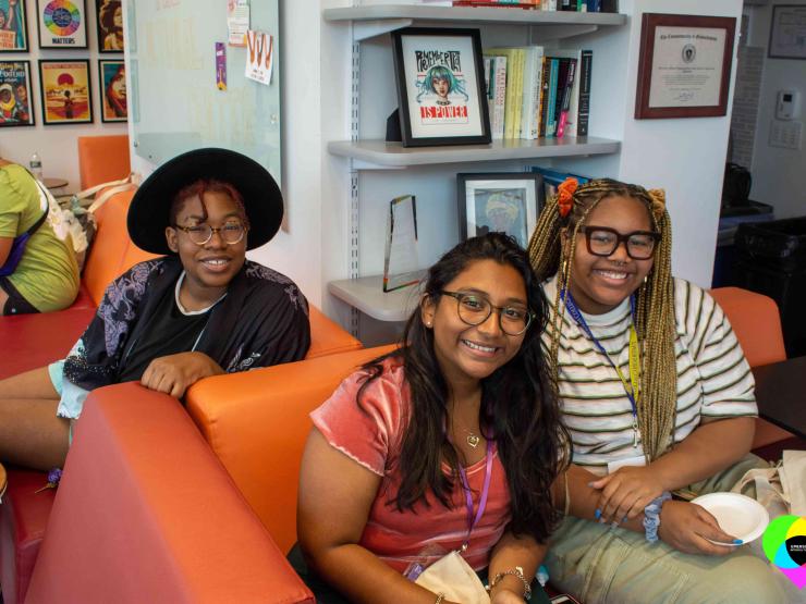 Three students sitting on a couch in the Intercultural Student Affairs office