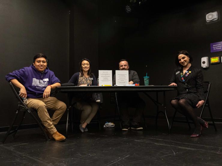 Four people sitting at a table