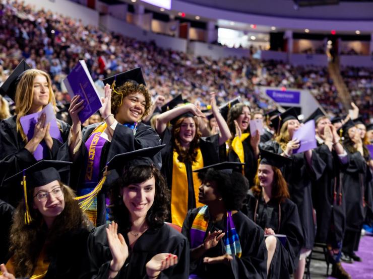 students cheering at graduation