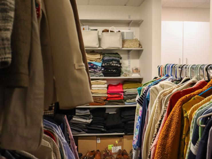 The clothes in the Career Closet room on clothing racks