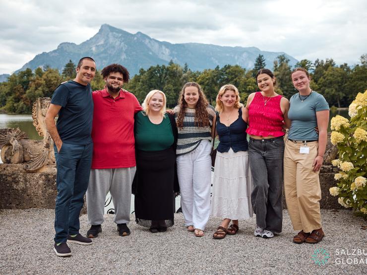 Students in Salzburg posed in front of the Alps