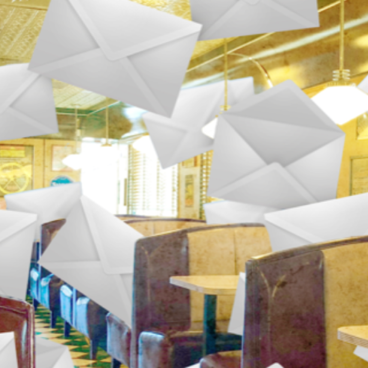 Large envelopes falling from the ceiling in a diner