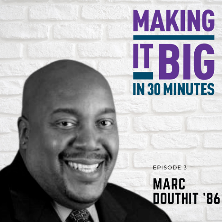 Marc Douthit posing next to the "Making It Big" logo