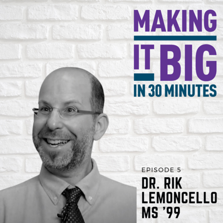 Dr. Rik Lemoncello posing next to the "Making It Big" logo