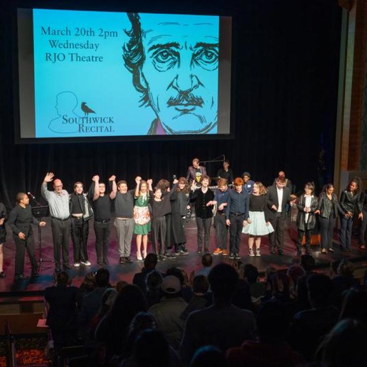 Emerson students and faculty stand on stage after performing in the Edgar Allen Poe-themed Southwick Recital.
