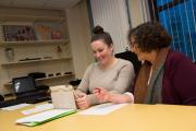 communication disorders graduate student talking to  faculty member