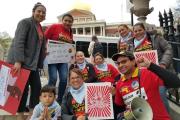 Group of people holding posters that read "Fund our Future"