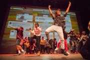 Troupe of dancers performing on stage