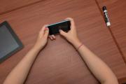 Close-up of a person’s hands holding a smartphone