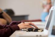 Focused shot of person on laptop