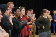 Row of students clapping in a practice room