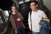 Students conversing inside Piano Row 