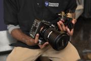 A pair of hands holding a camera
