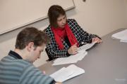 Faculty member going over paperwork