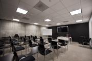 Empty chairs and empty desks in an empty classroom