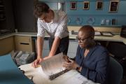 Student and faculty member helping each other