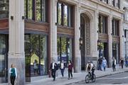 People walking outside of the Little Building in Boston on Boylston Street