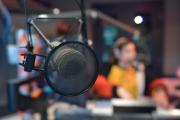 Microphone in focus with WERS radio room background blurred