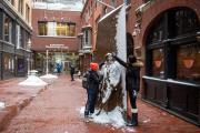 Two students playing on a snow day