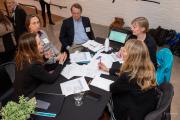 Group of faculty members having a discussion