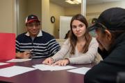 A graduate student works with adult clients in the Robbins Center