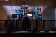 student using six computer monitors