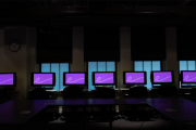 Computers lined up, side by side in the Emerging Media Lab