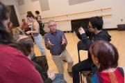 Image of a professor teaching a group of students