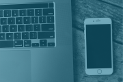 View of phone next to a laptop with light blue overlay