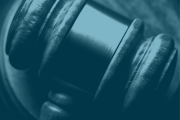 A photo of a gavel with a light blue overlay