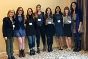 Female Honor students posing for photo against a white wall