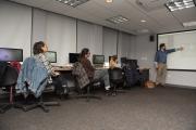 students listening to a professor in the classroom