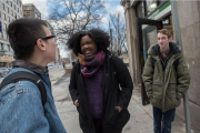 Three students talking and standing by the Boylston Street T entrance